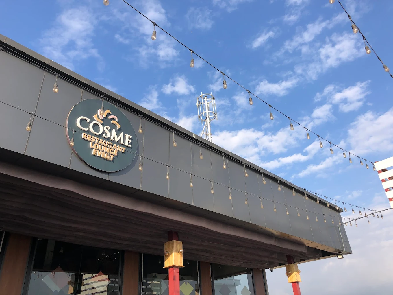 roof photo of cosme restaurant where the logo is visible